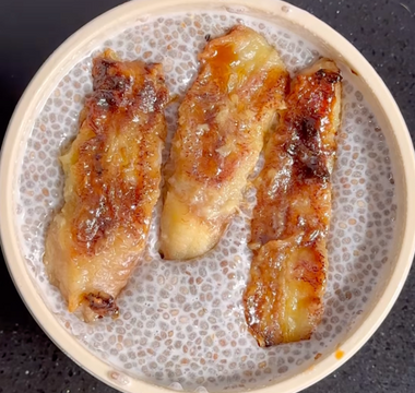 Caramelized banana slices in a speckled ceramic bowl, ready to serve